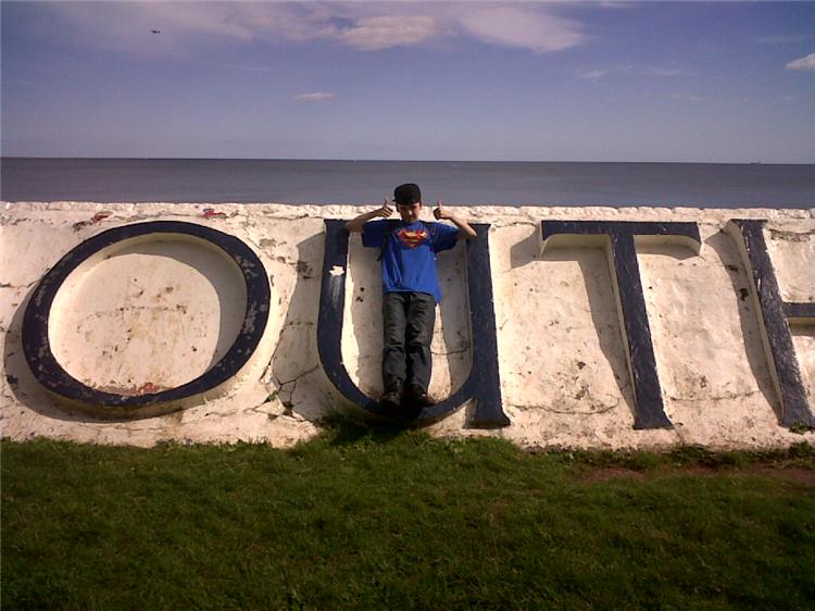 Andrew on the Teignmouth sign